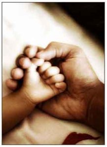 A father holding childs hand